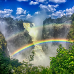 Zambian waterfall with rainbow